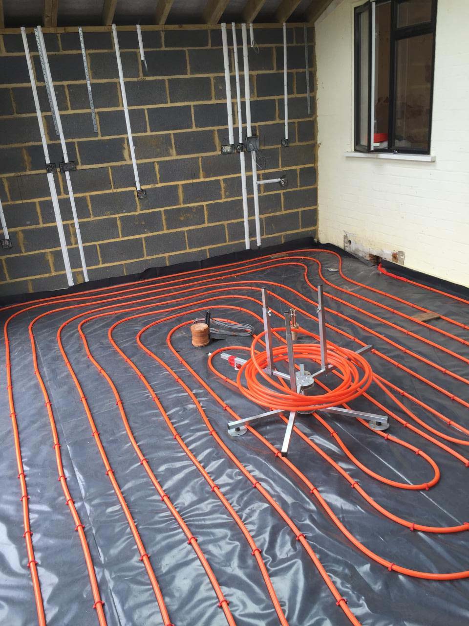Underfloor heating being laid prior to screeding
