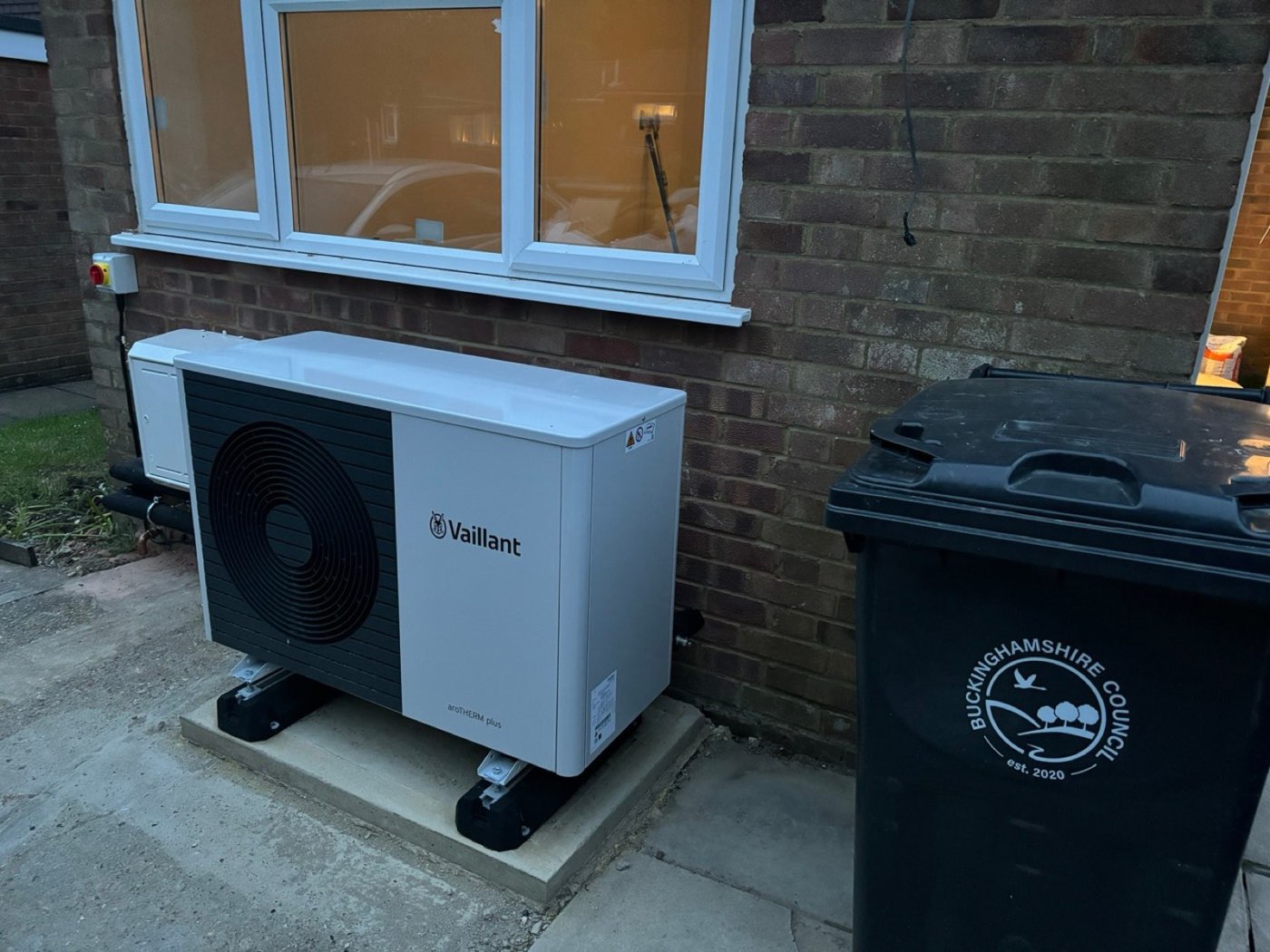 Vaillant aroTHERM air source heat pump fitted beside the house